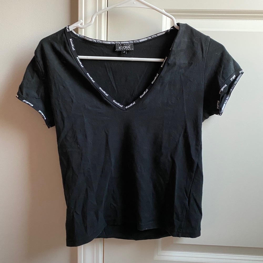 cropped black tee with design on neck and arm